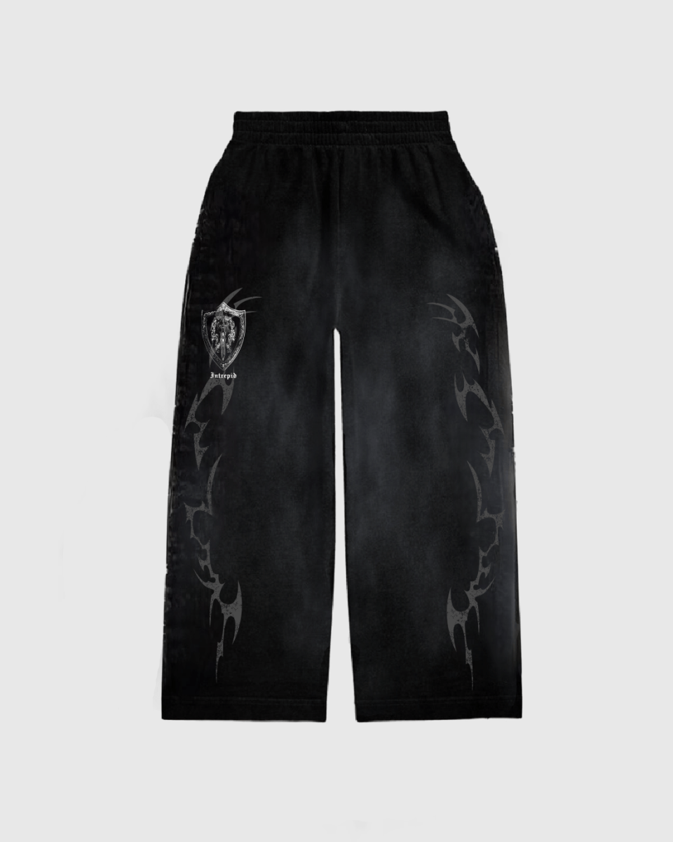 Black sweatpants with a flared open bottom and oversized screen print design in white, featuring a graphic that resembles a tribal or geometric pattern.