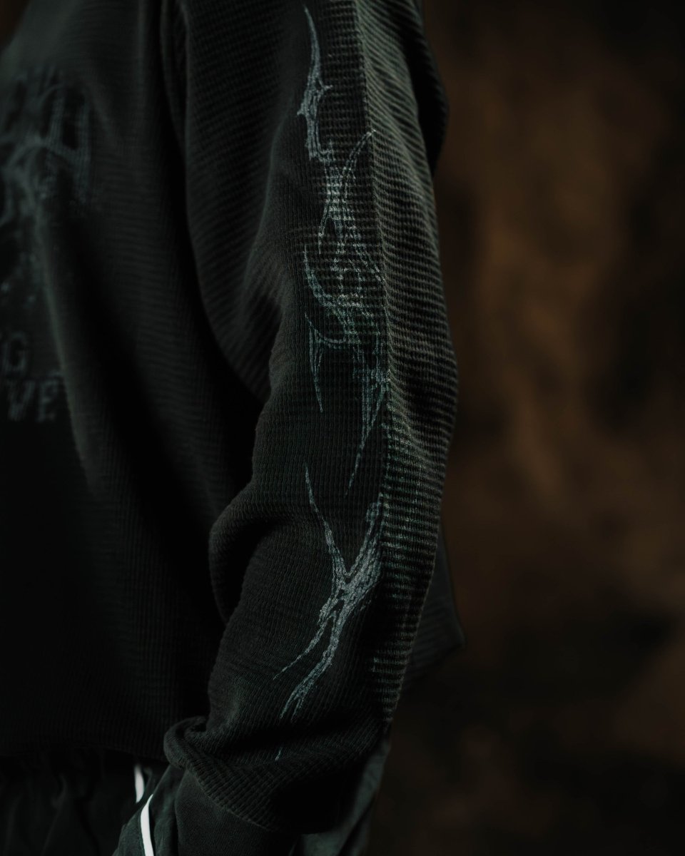 Dark hoodie with text design on a dark background