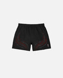 Black shorts with red designs on a light gray background