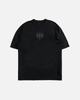 Black t-shirt with a small white logo on a light gray background
