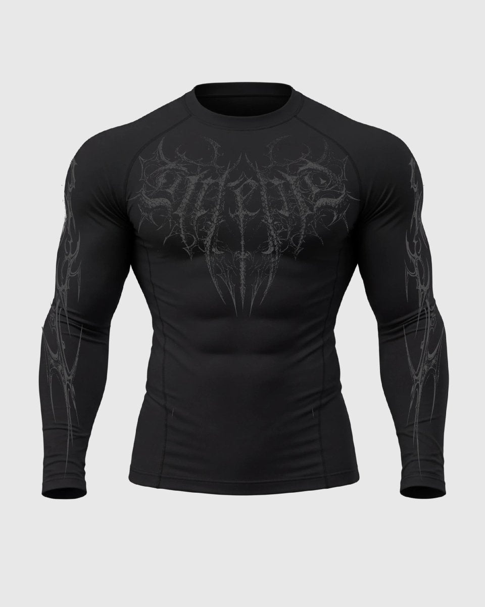 Black long-sleeve shirt with graphic design on a light gray background