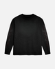 Black long-sleeve shirt with abstract designs on sleeves against a light gray background