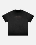 Black t-shirt with a graphic design on a light gray background