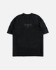 Black t-shirt with a logo on a light gray background