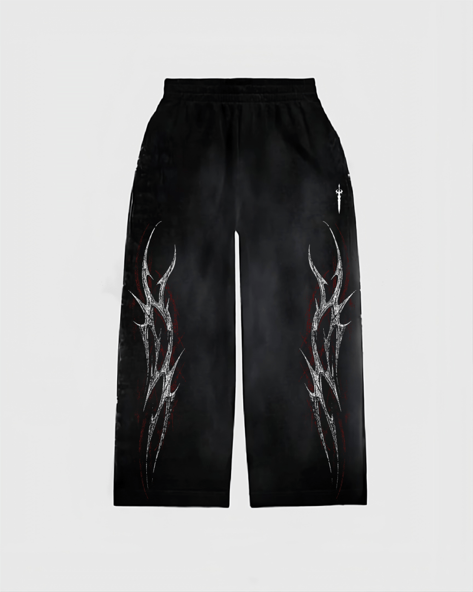 Black pants with white abstract designs on a light gray background