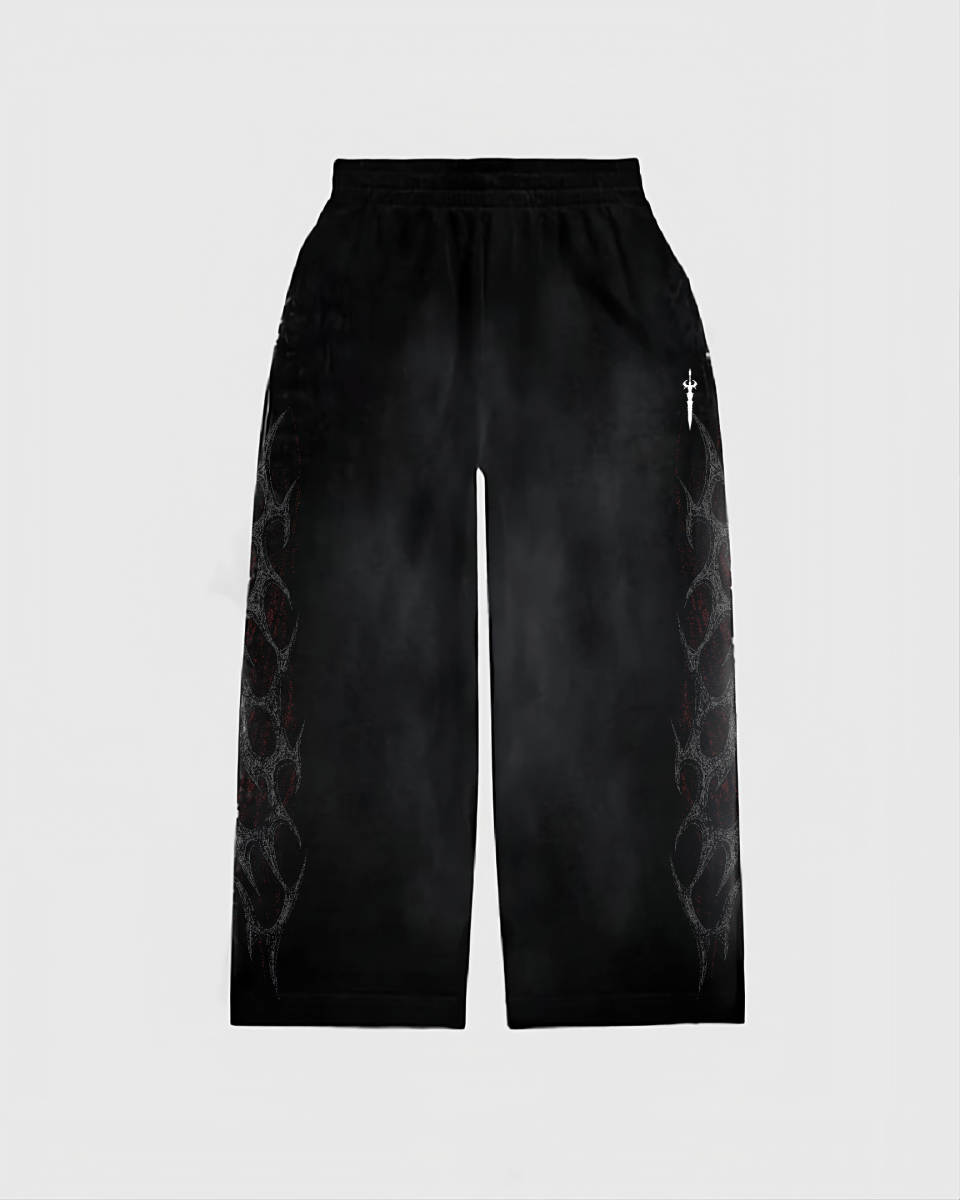 Black pants with geometric patterns on a light gray background