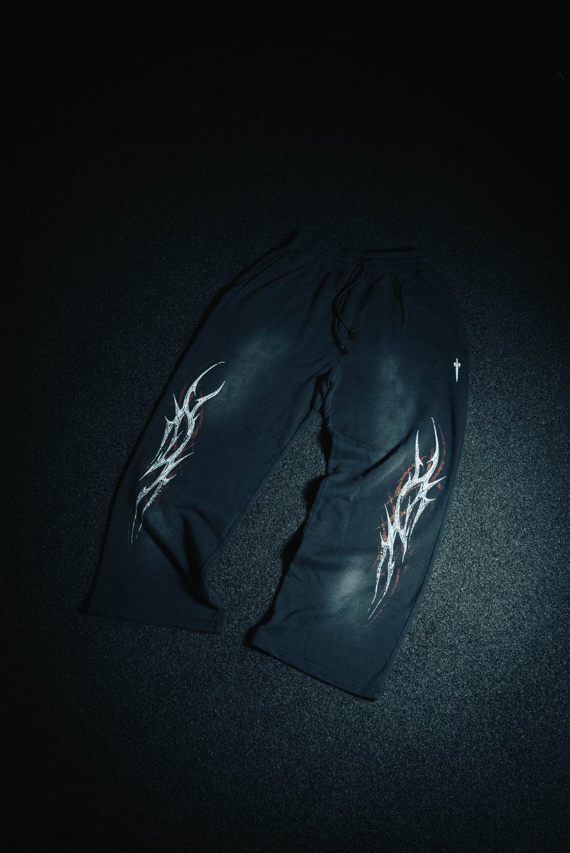 Black gloves with white designs on a dark background